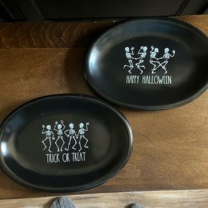 Two oval black Rae Dunn Halloween plates, barely used